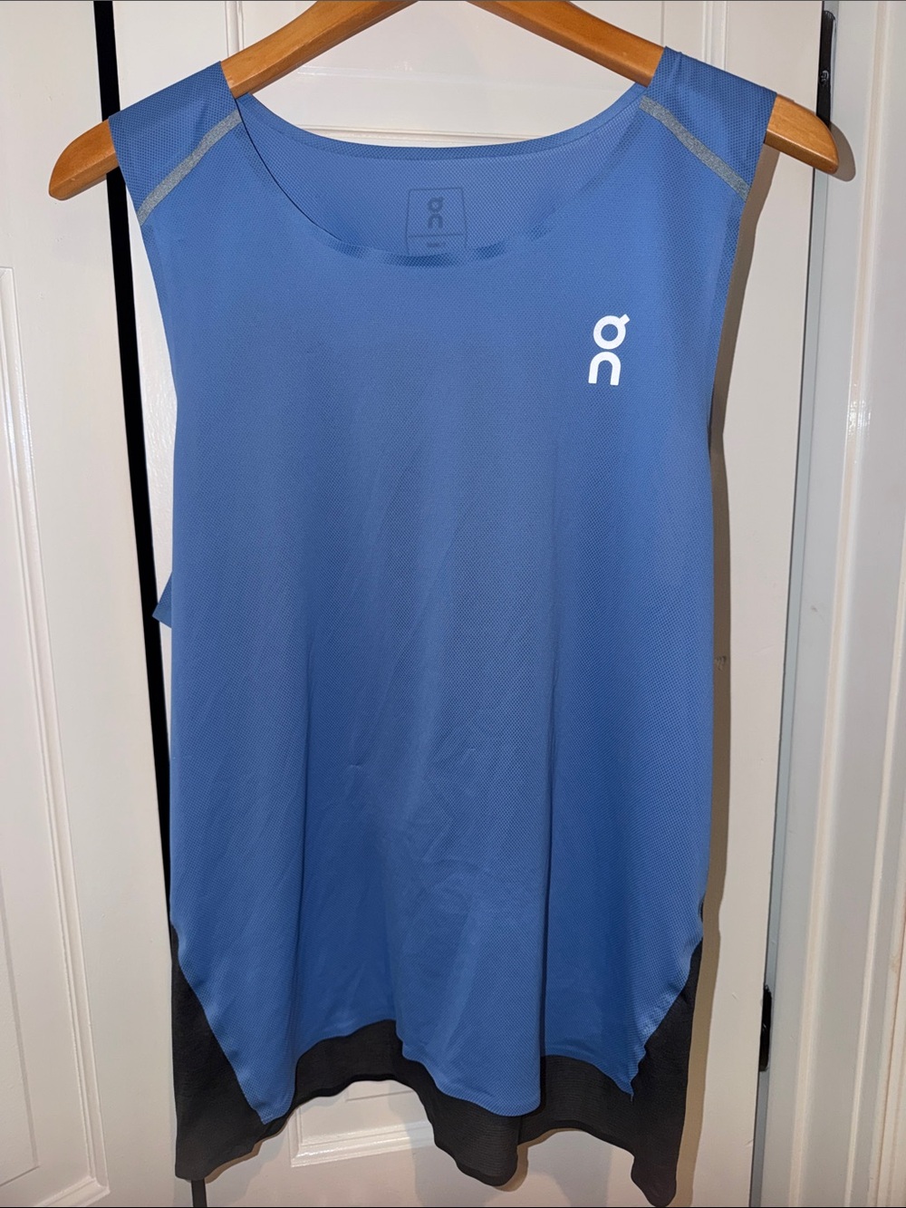 On Running Blue Sleeveless Performance Tank with Black Hem